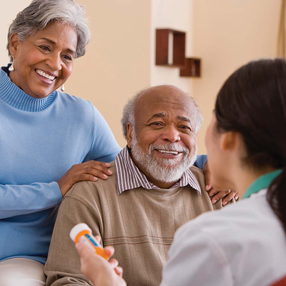 Healthcare worker with client and medication